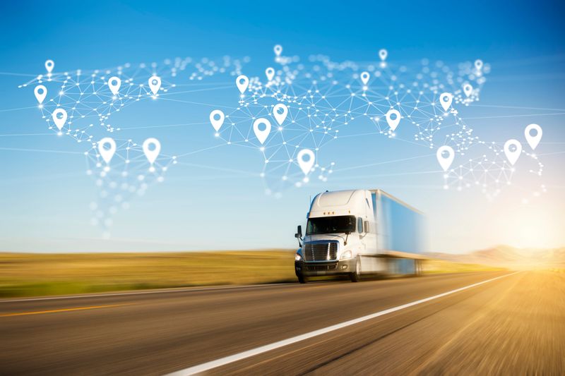 Container Truck on Highway with Polygon Network World Map Graphic and Location Pins.