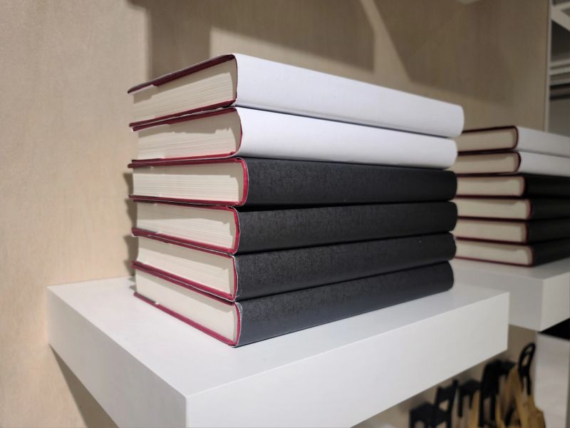 books piled up on the bookshelf