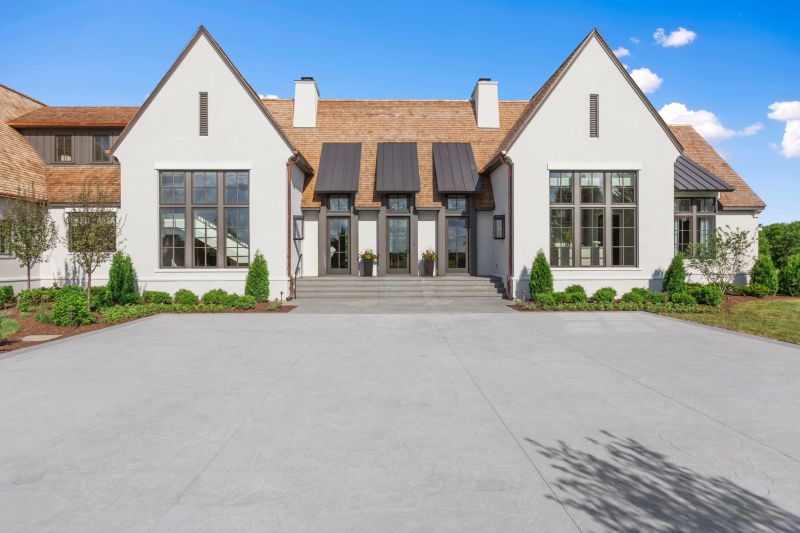 Huge parking area near front porch steps and surrounding landscaped yard