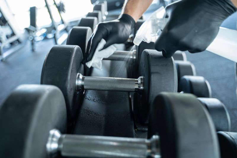 Cleaning dumbbell and weights regularly after used with disinfectant spray is important