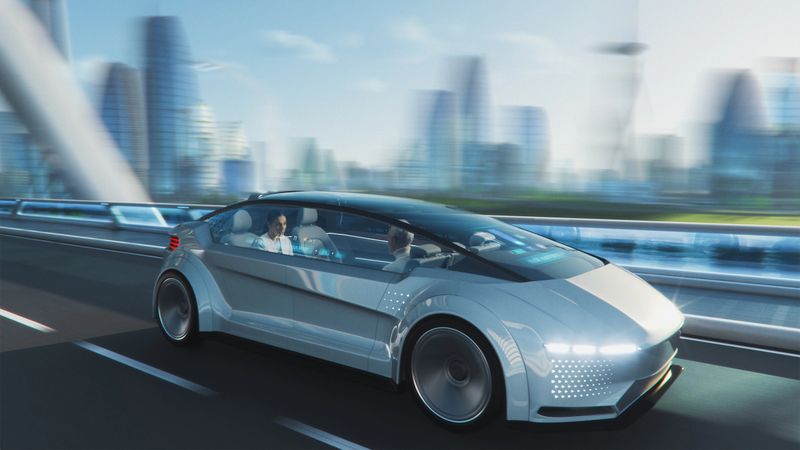 Futuristic self-driving van on highway in modern city