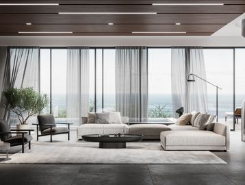 Modern living room with ocean view and spiral staircase.