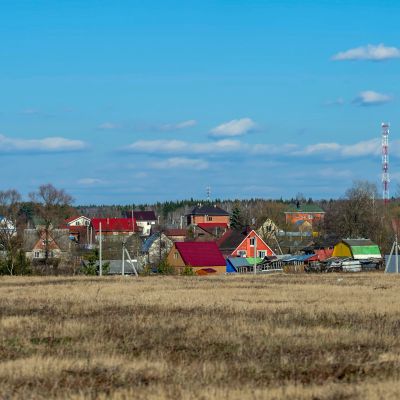 Small rural village under clear blue sky.