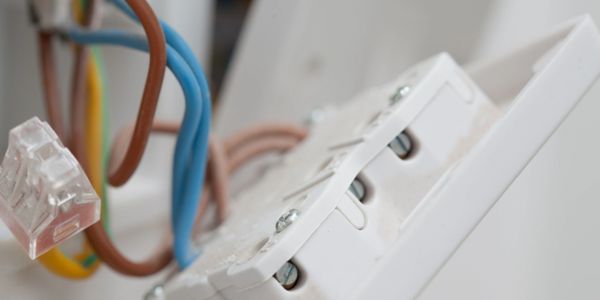 Electrical socket cables / electrician carrying out maintenance 