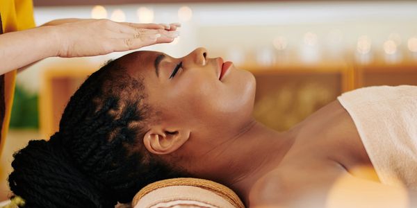 Therapist restoring energy flow through Reiki session at Wholly Spirit Hands in Sugar Land TX.