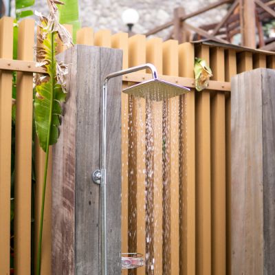 Outdoor shower with water running.