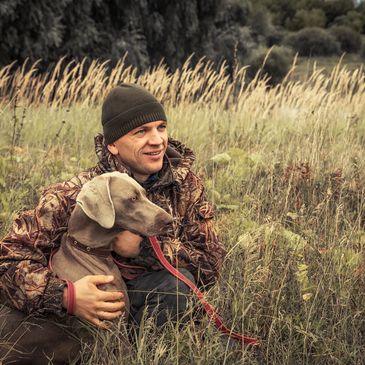 Man in Camo with Dog