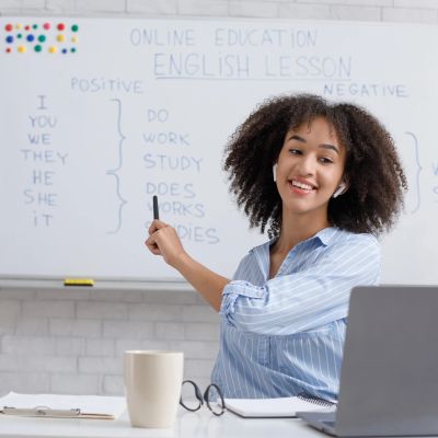 Teacher conducting an online English lesson.