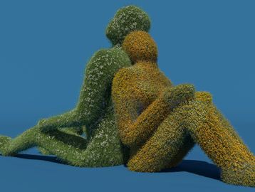 Two figures made of foliage sitting back to back.