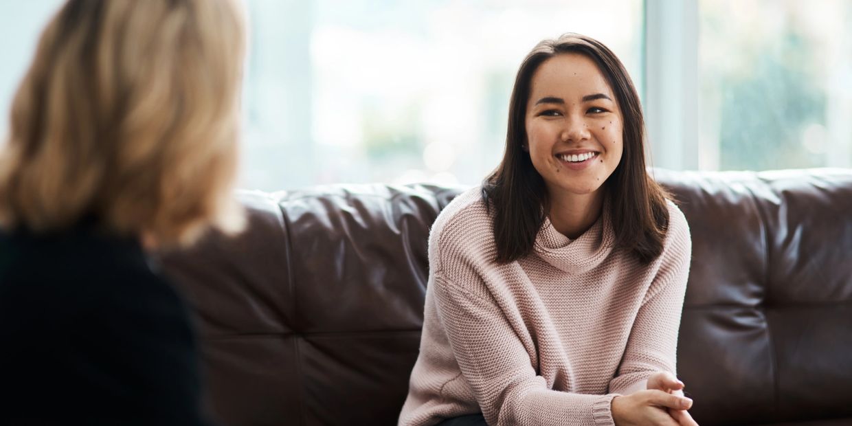 smiling woman in individual therapy session