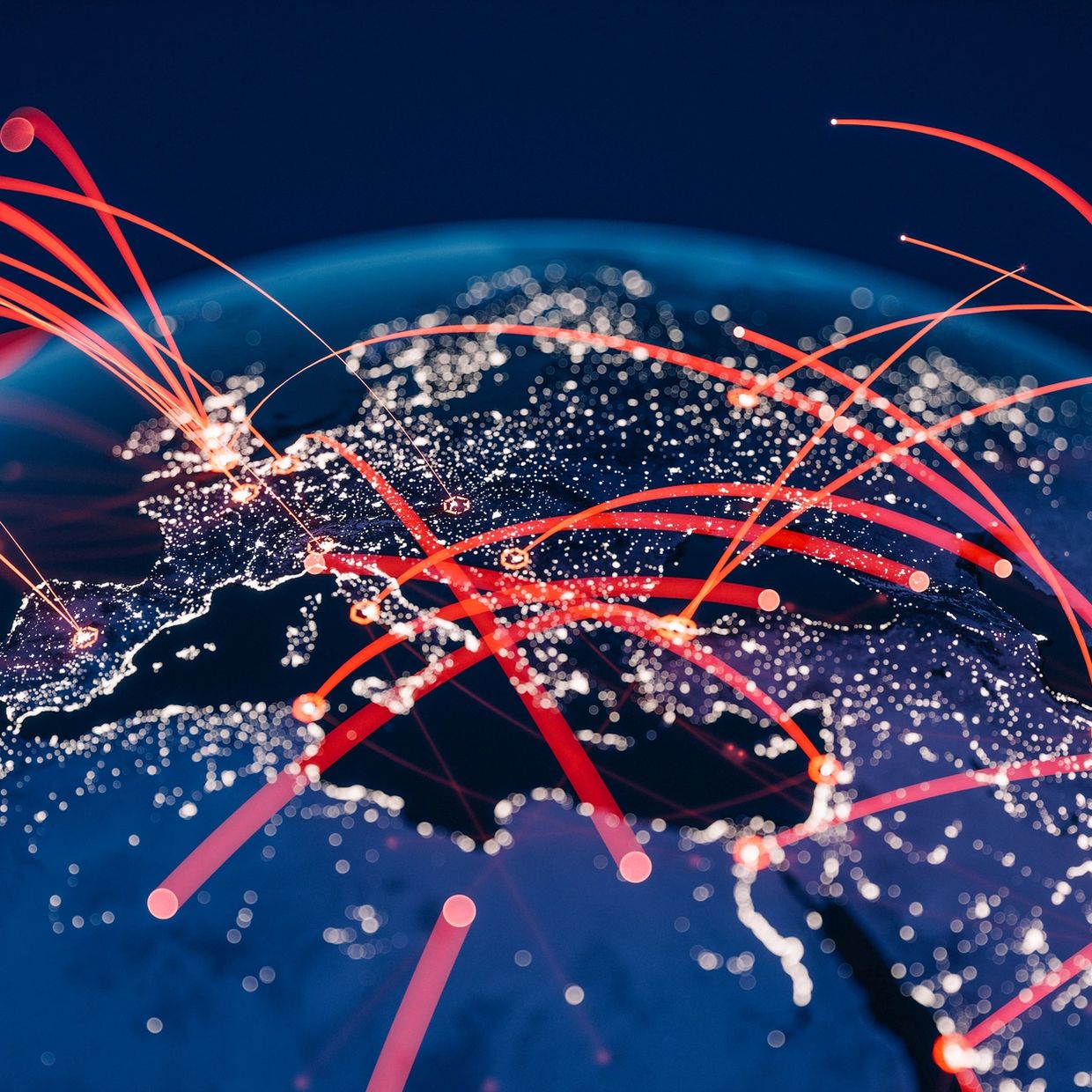 Digital globe with red data connections lighting up Europe and surrounding regions at night.
