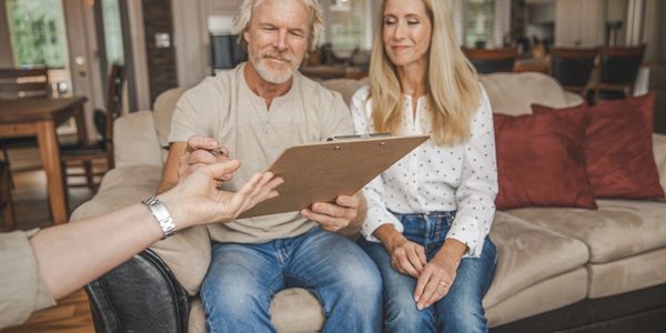 Homeowner discussing property evaluation and upgrade options with consultant in Vancouver