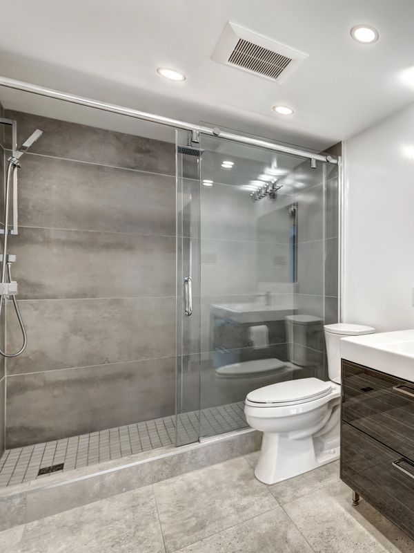 Modern bathroom with clean tiles and fresh grout.