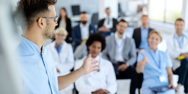 Business consultant hosting a seminar to advise healthcare leaders