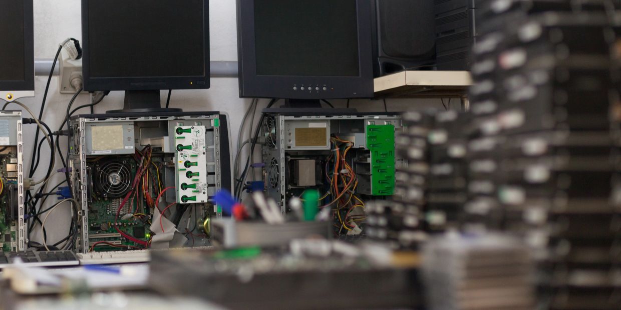 Technicians maintaining legacy Kenwood gear.