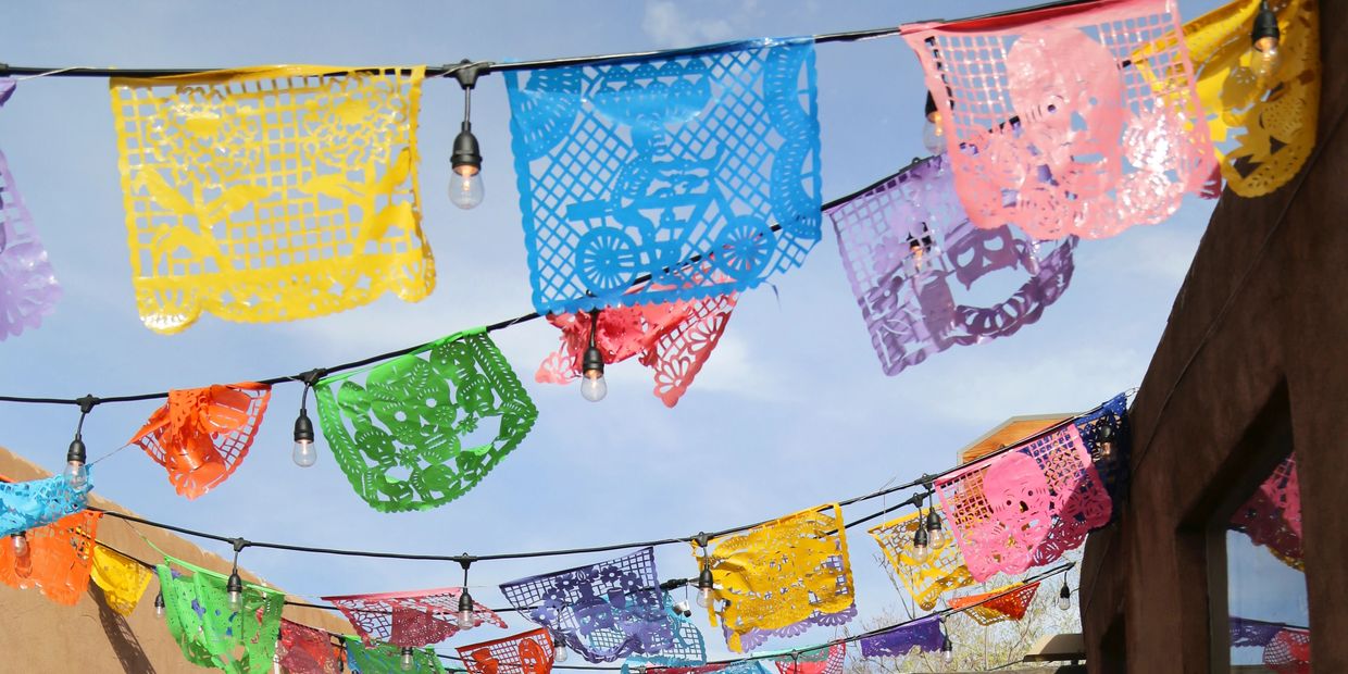 A picture of different paper art work decorated on the streets 