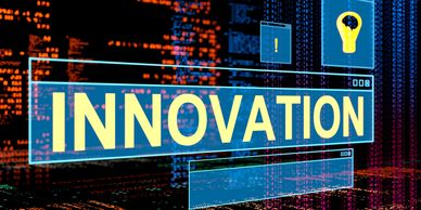 The word INNOVATION highlighted in a futuristic digital interface with light bulb and exclamation icons.