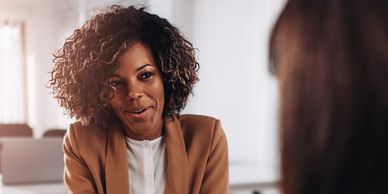 Woman in a conversation at an office.