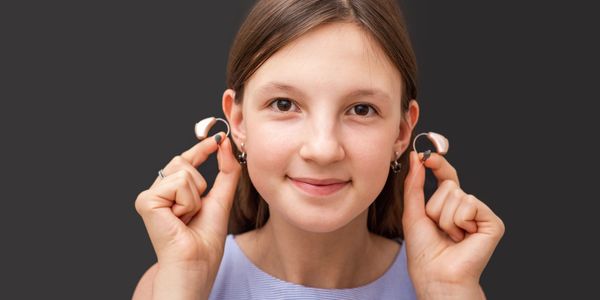 Happy patient with bilateral hearing aid