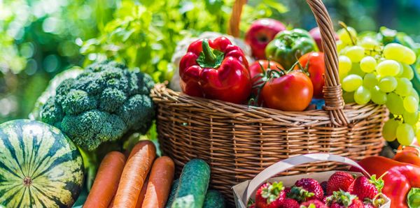 Basketball-sized watermelon, fresh carrots, broccoli, and a basket of assorted fruits and vegetables.