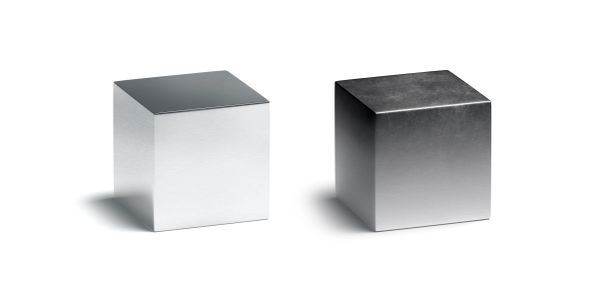 Two metallic cubes with different shading and lighting.