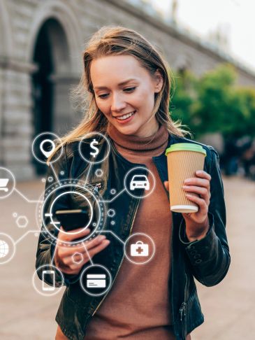 Young woman using smartphone with digital icons for finance and transportation.