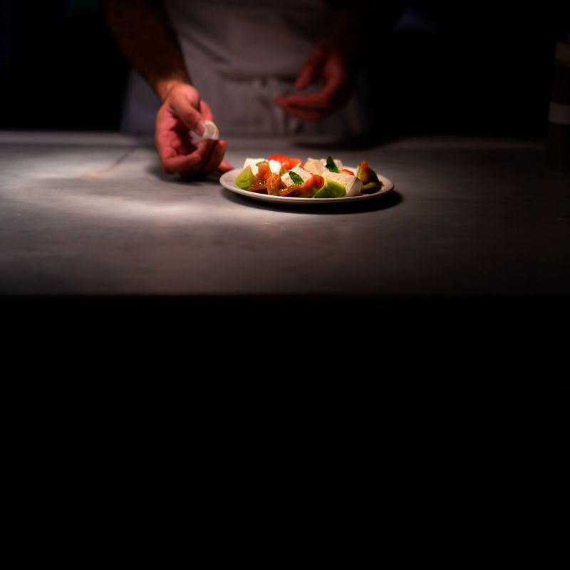 Finishing a caprese salad