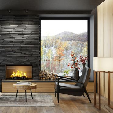 Modern living room with fireplace and large window showcasing scenic autumn hills.