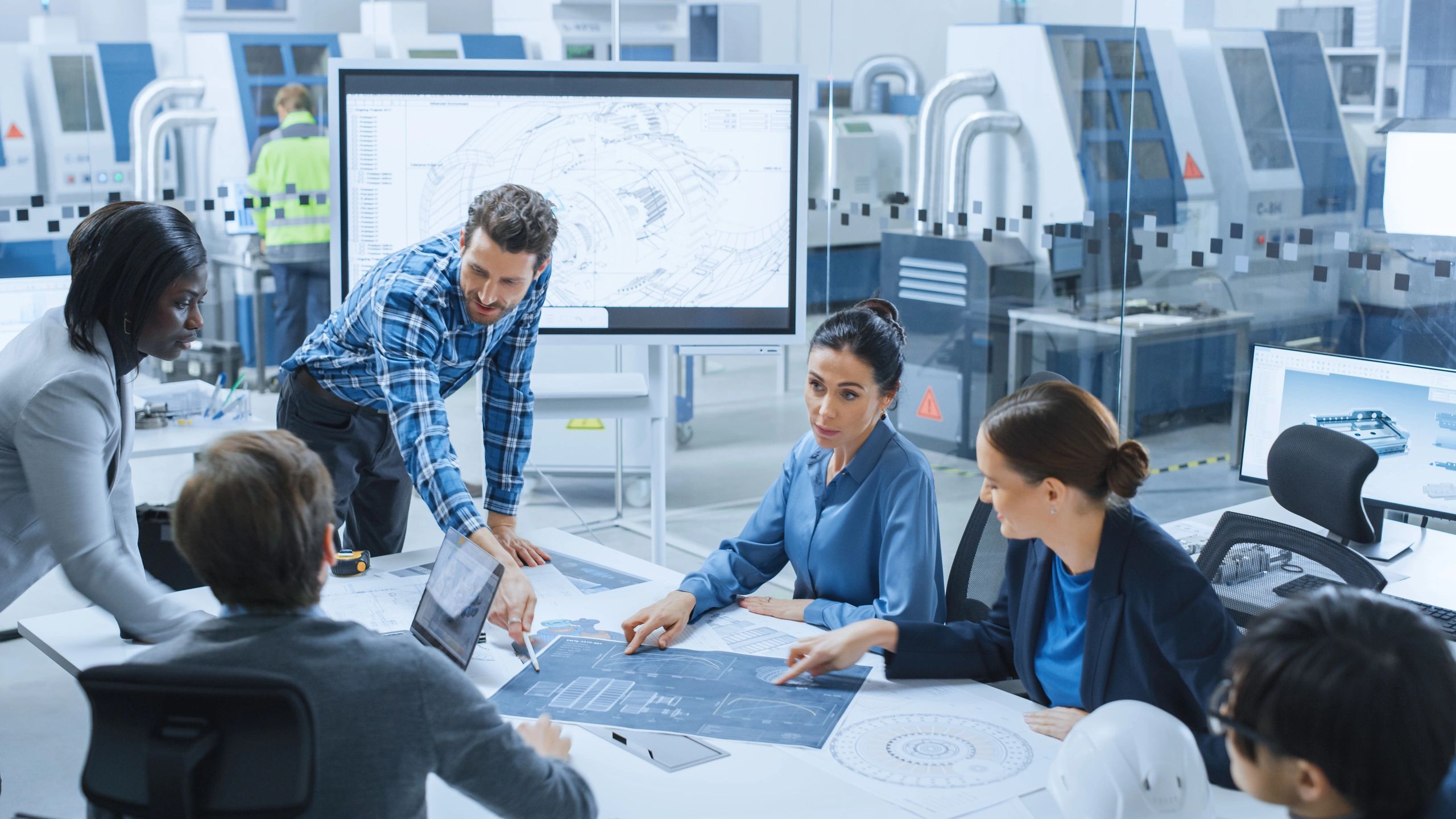 A group of Engineers working on desings solutions 