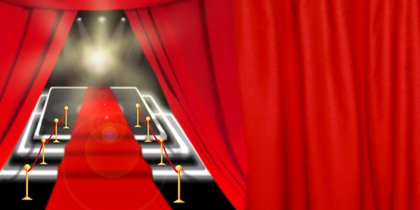 Red carpet event entrance with glowing lights and red curtains.