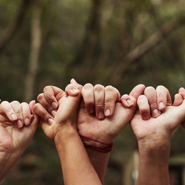 Hands linked together in unity.