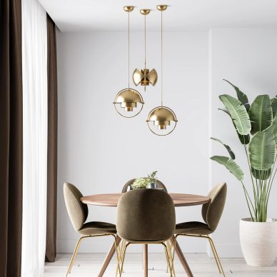 Modern dining area with gold pendant lights and olive green chairs.