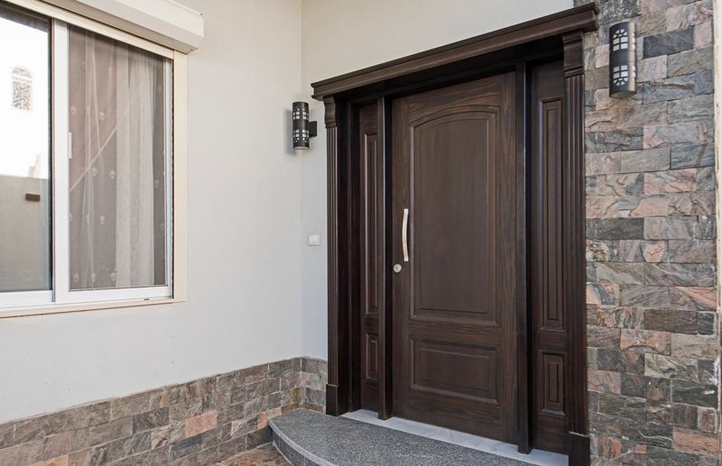 Elegantly crafted wooden doors showcasing premium finishes and intricate designs