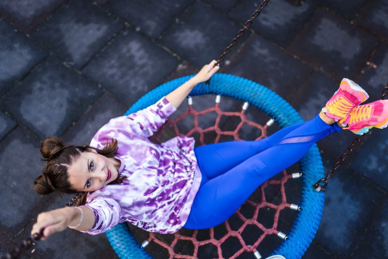 Portrait of young woman having fun who wearing new tie dye sweatshirt