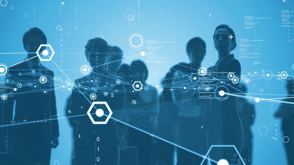 Silhouettes of business people with digital network connections overlay.
