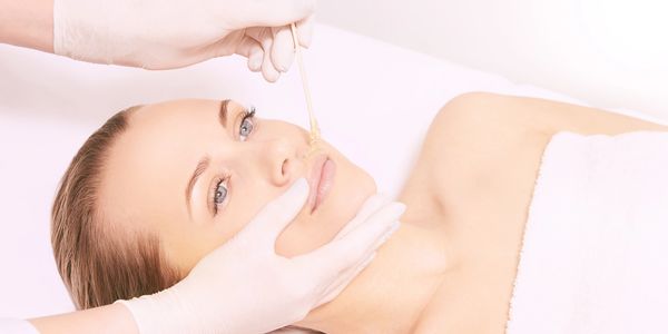 Woman receiving a full face waxing in Everett, Washington at Autumn Noel Esthetics.