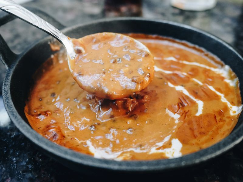 Dal makhani (or dal makhni), India curry made from lentils (urad), beans (rajma), butter and cream.