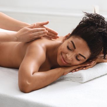 Woman enjoying a relaxing shoulder massage.