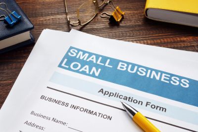 Small business loan application form on desk.