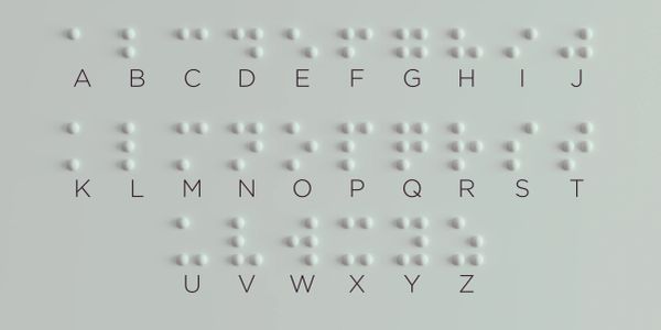Braille alphabet chart with letters A to Z.