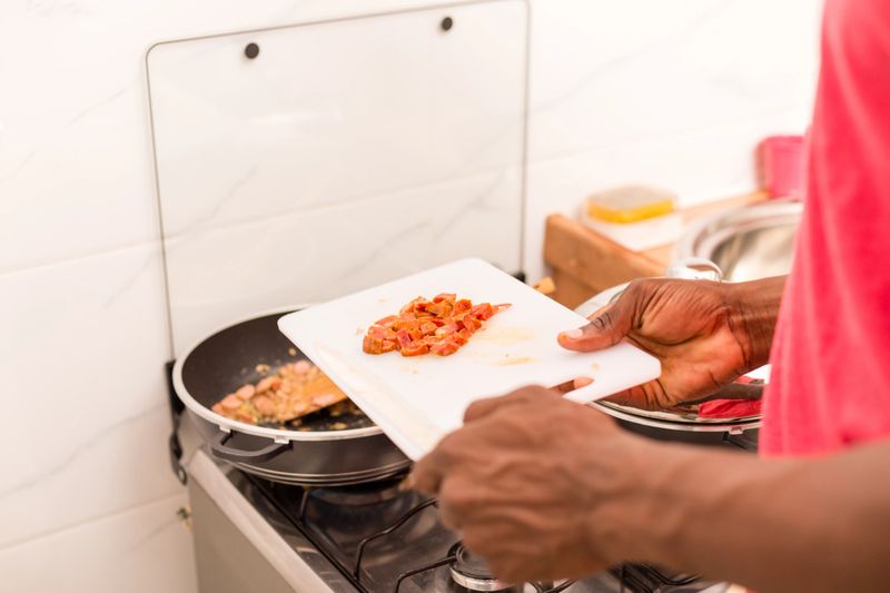 Black African American couple preparing food in the kitchen