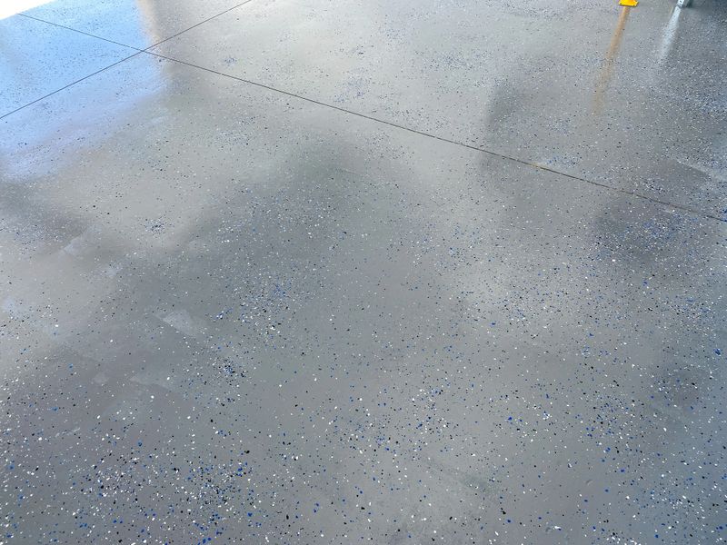 Stunning flake epoxy flooring showcasing vibrant colors and a glossy finish in a modern industrial space.