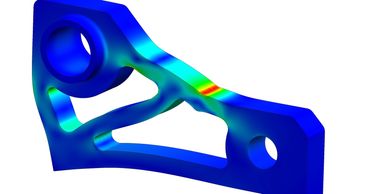 Stress distribution on a mechanical part with high-stress areas in red.
