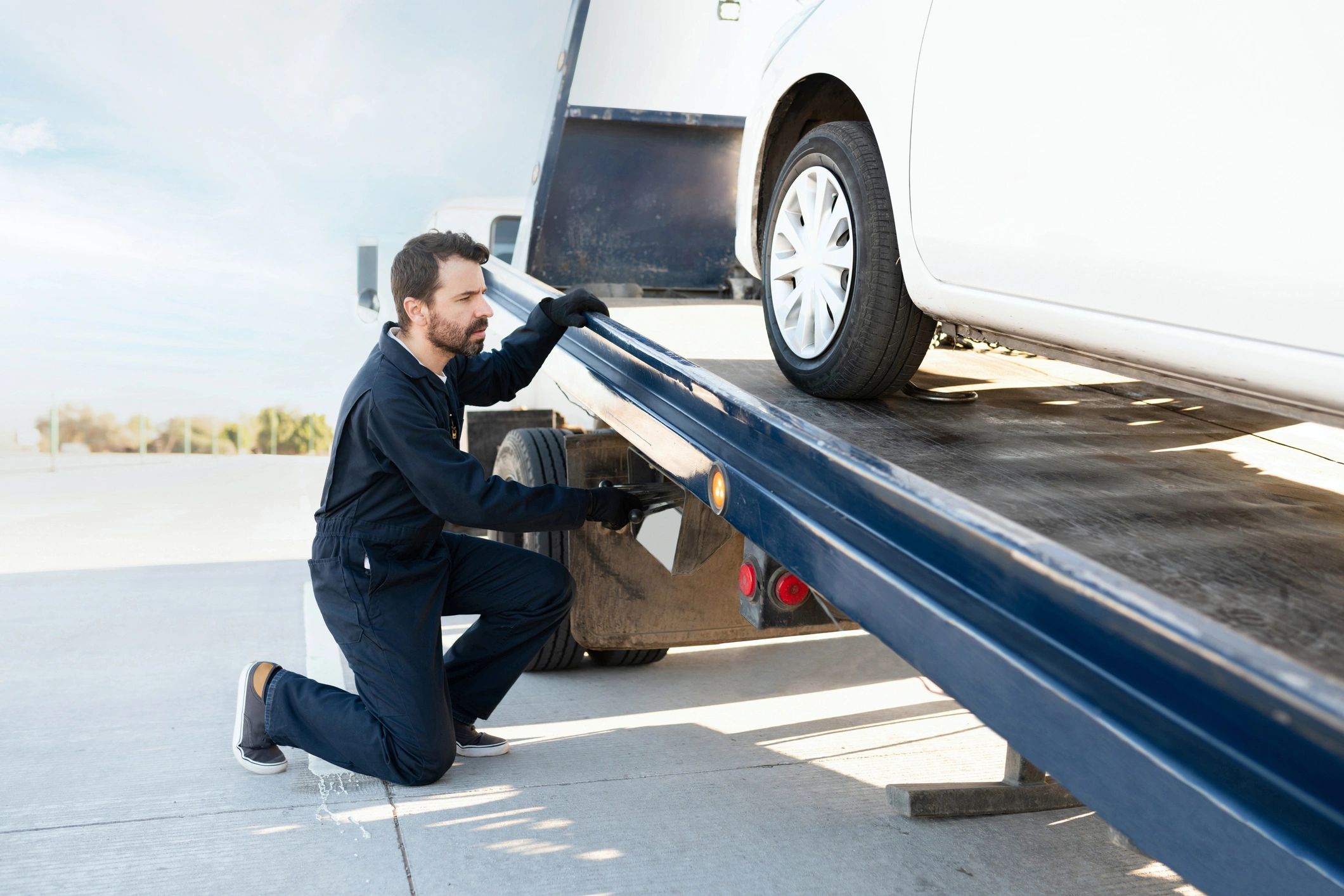 Kelly's Car Care and Towing. (Home of the 65 dollar Tow) logo