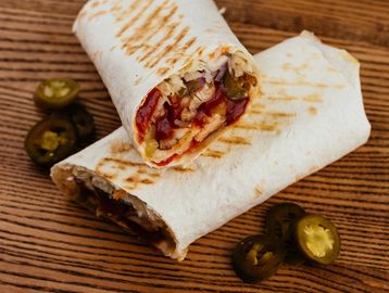 Tender, spiced chicken wrapped in a warm tortilla with a medley of fresh veggies, french omlet  zest