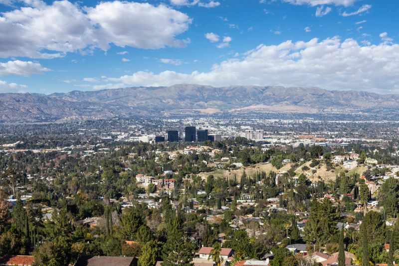 View of Woodland Hills with partly cloudy sky in the west San Fernando Valley area of Los Angeles, California.