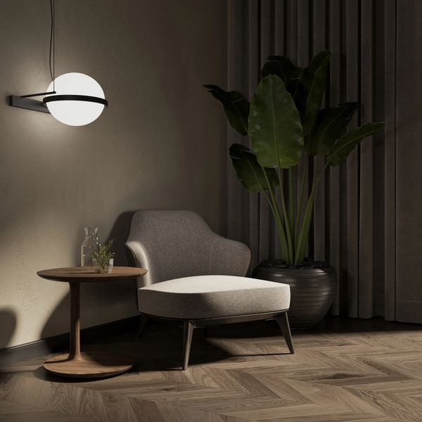 Cozy corner with a modern armchair, wooden side table, large potted plant, and glowing spherical wall light.