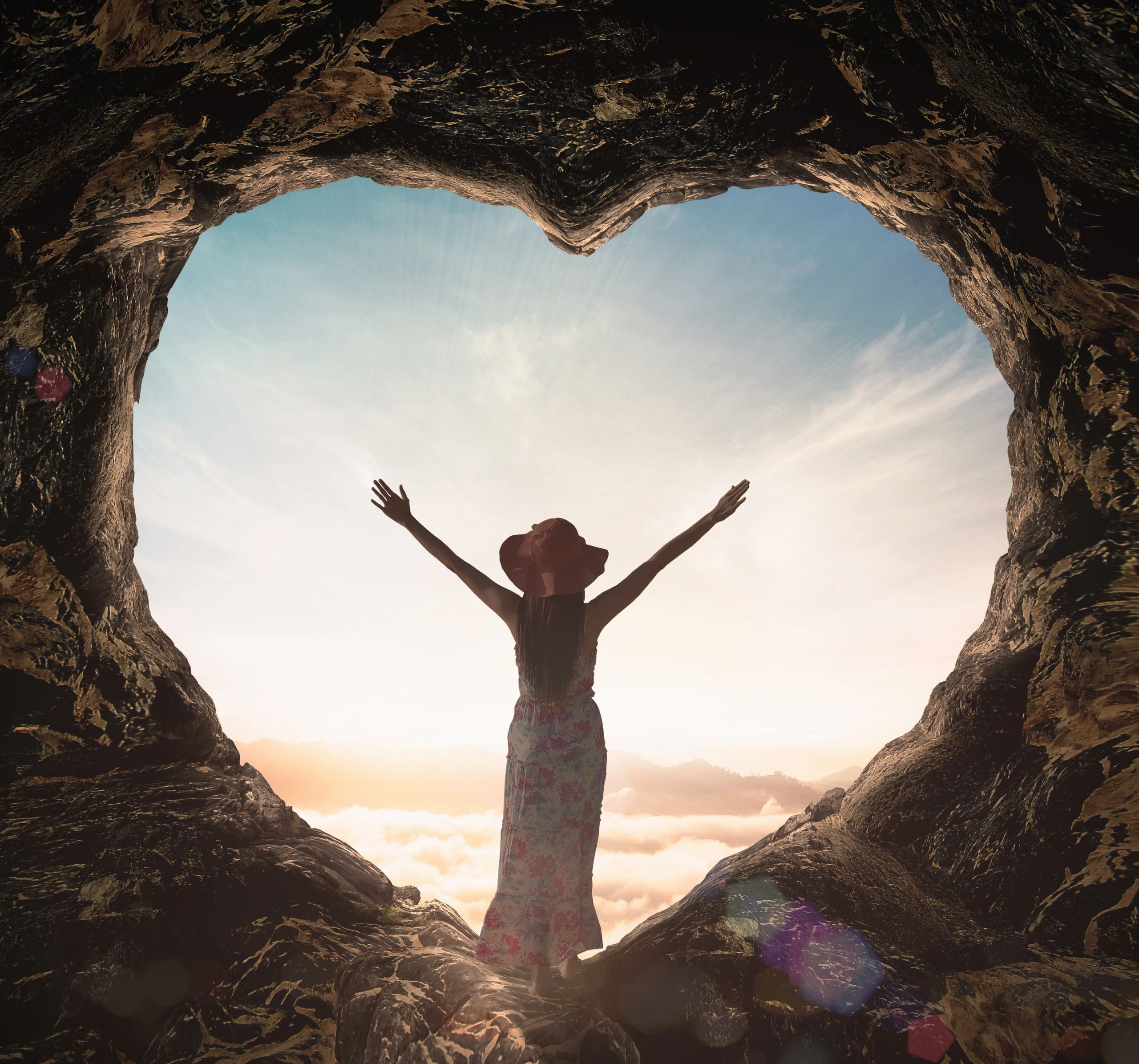 Lady looks happy outside heart-shaped cave