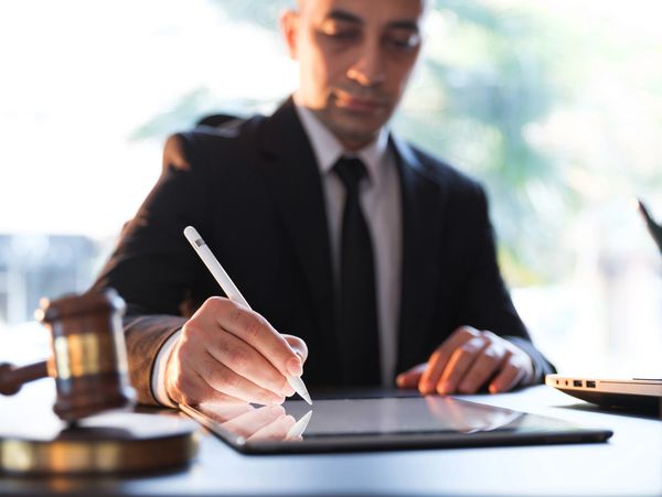 Notary signing legal documents with professionalism.