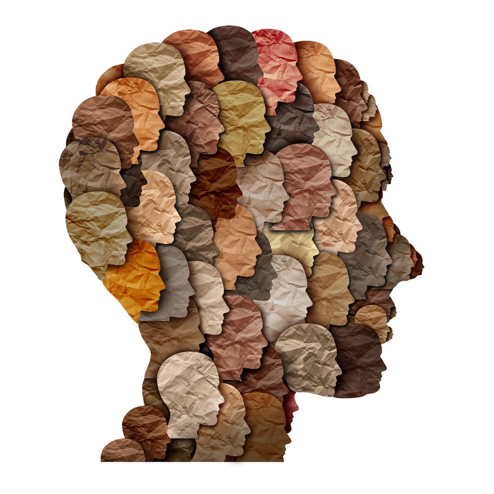 Diverse human profiles in various skin tones forming a globe shape.